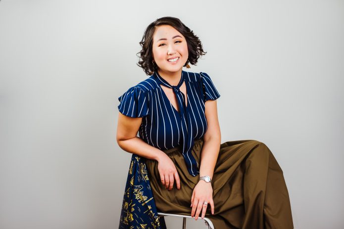 Headshot of Theresa Chu-Bermudez on chair