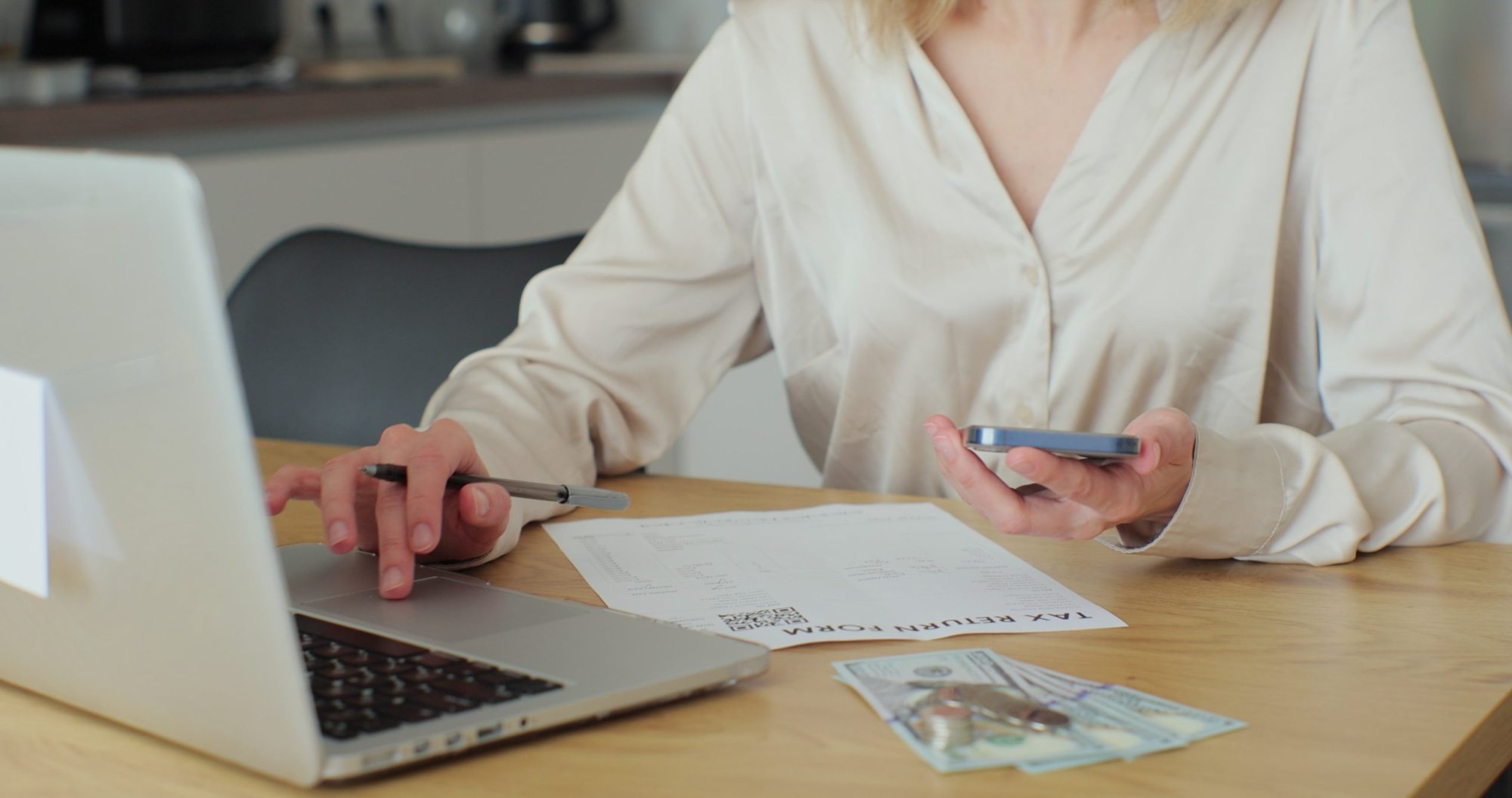 shutterstock-2284139855-scaled-1 Travel agent reviewing itineraries and travel documents at her desk