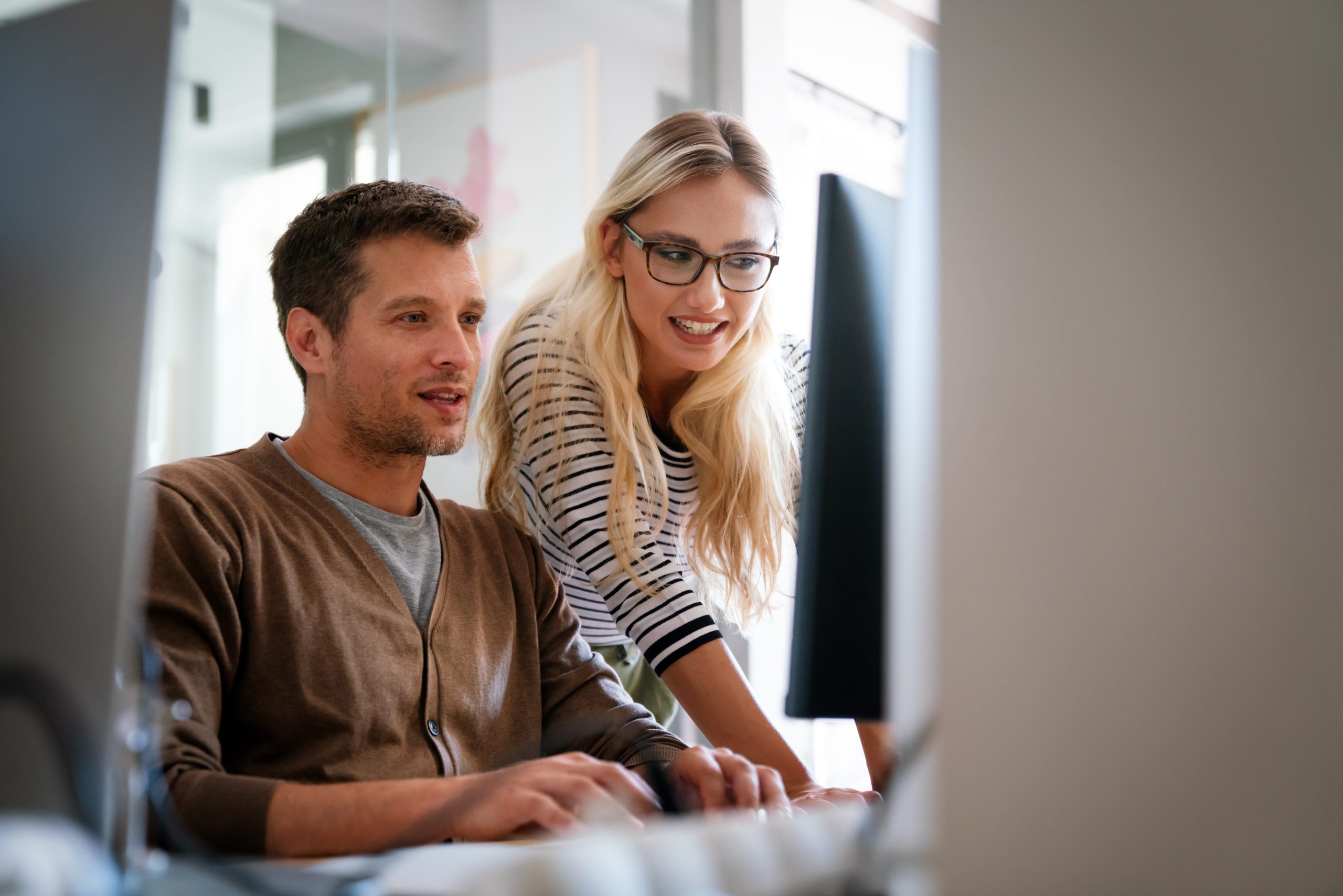 Programmers cooperating at IT company developing apps. Business people technology concept